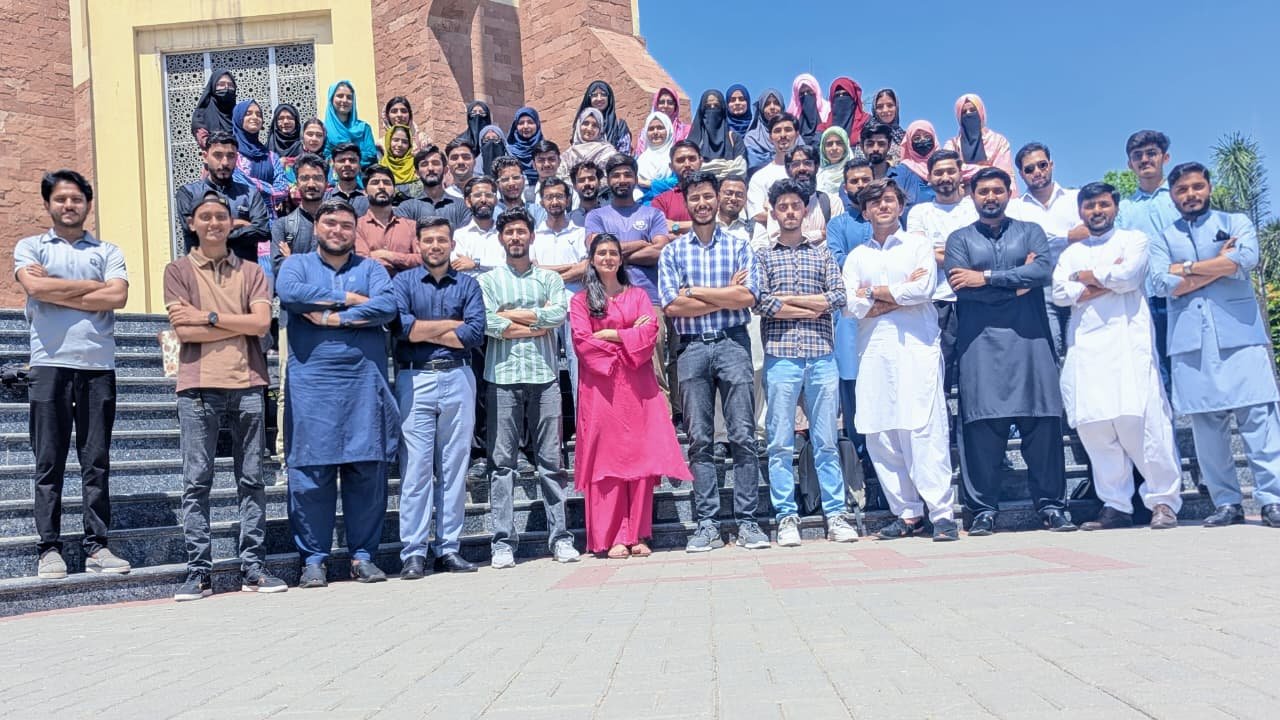 Batch posing with crossed arms on steps