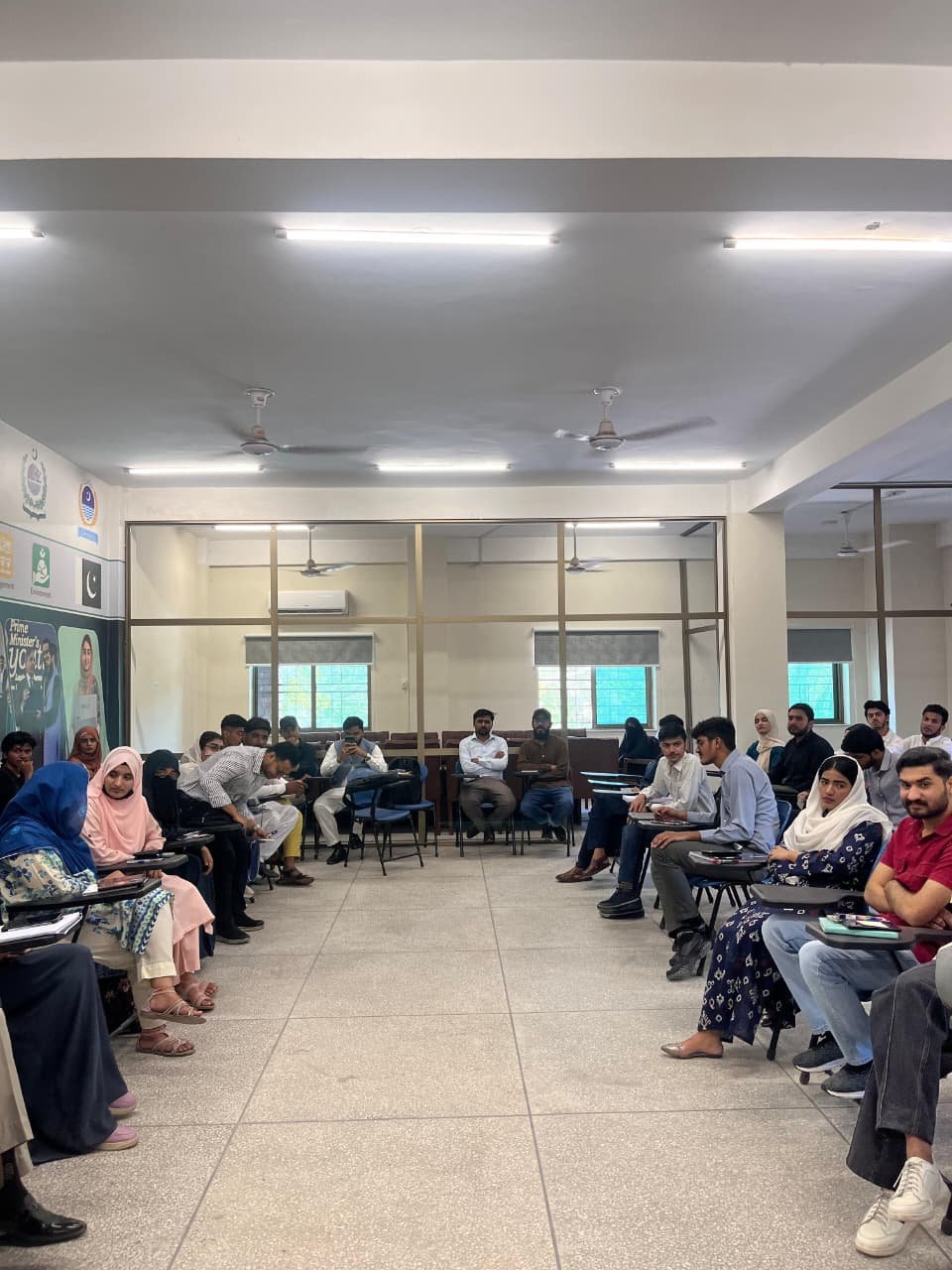 Fellows sitting in a circle during a session