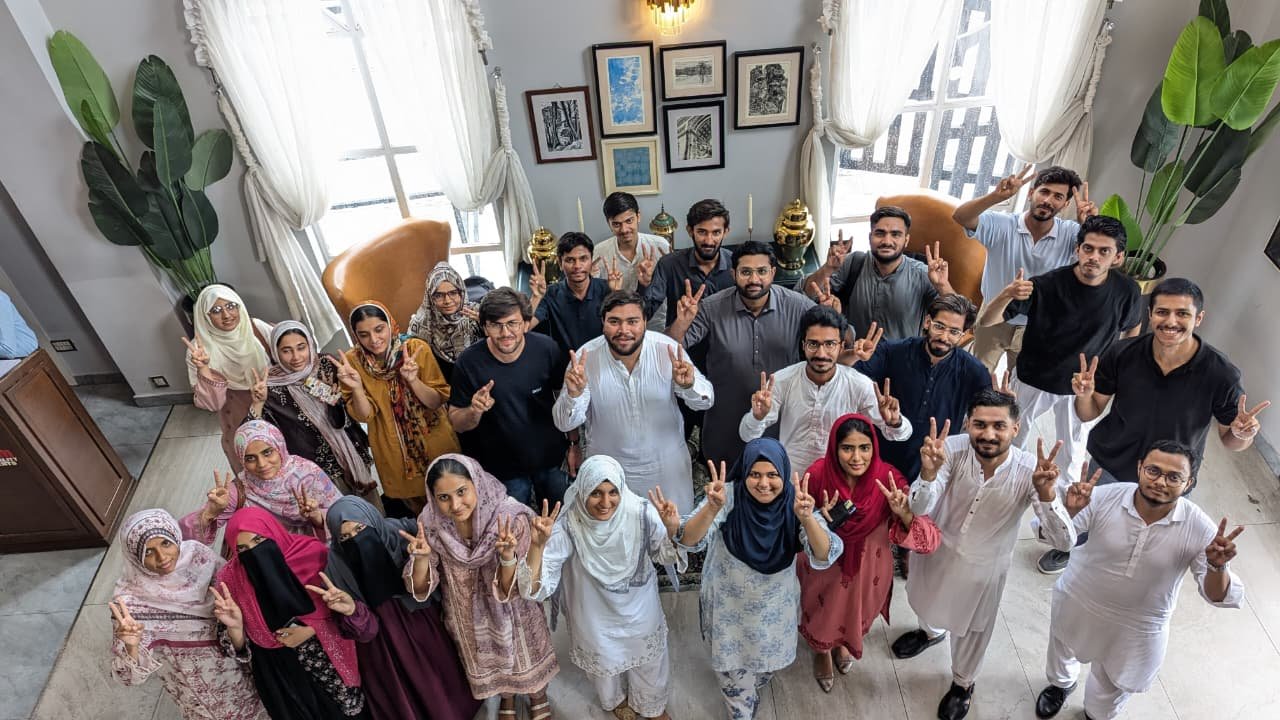 Overhead shot of batch making victory signs